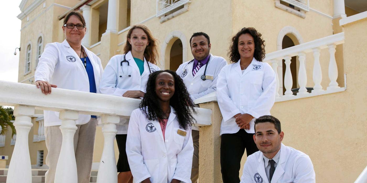 Group picture of AUC students in white coats