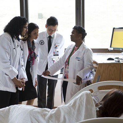 Doctors talking in patient room