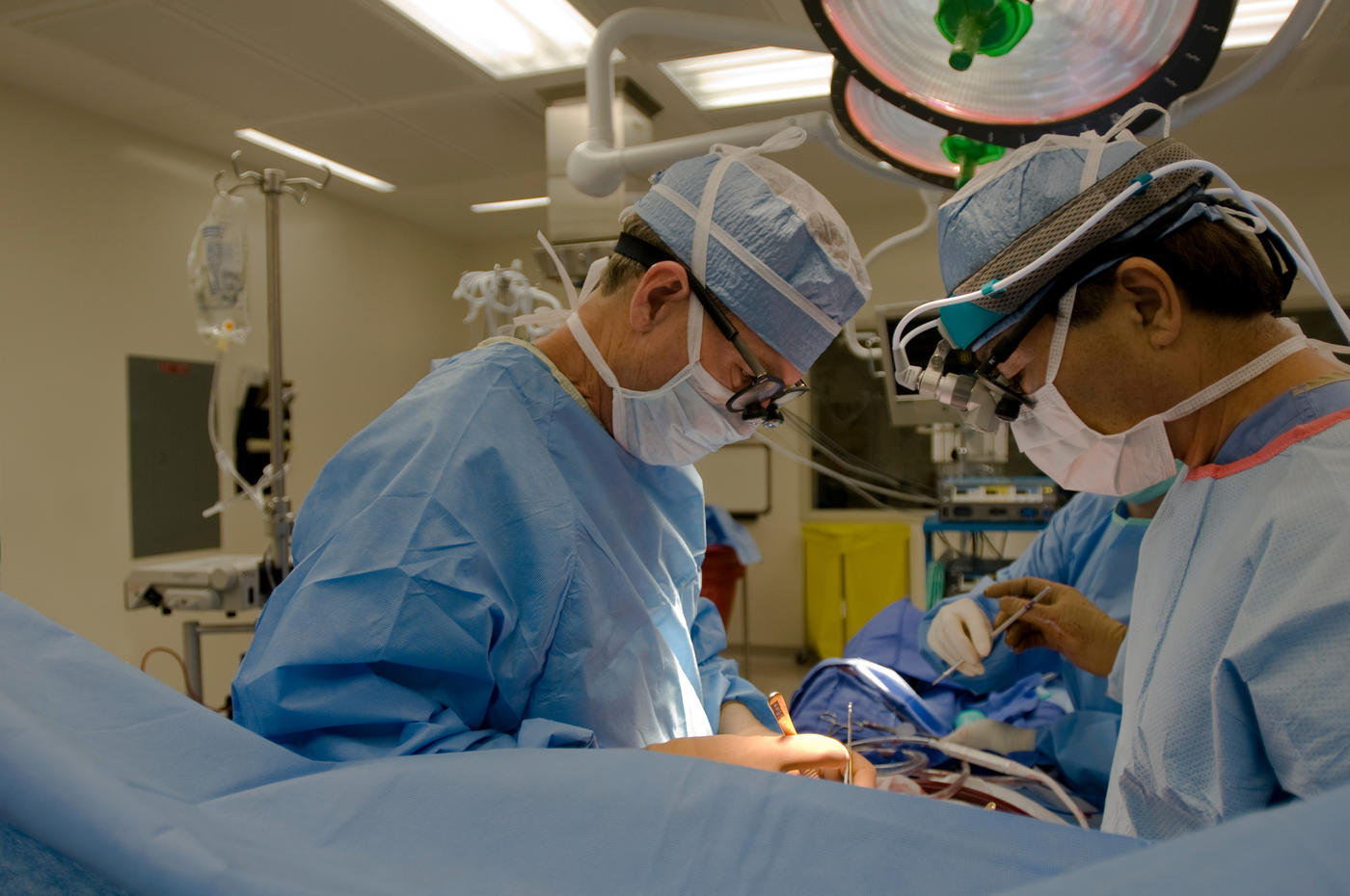 Surgeons performing coronary bypass surgery 