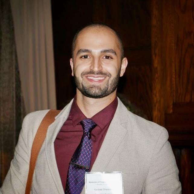 A smiling student at a research event