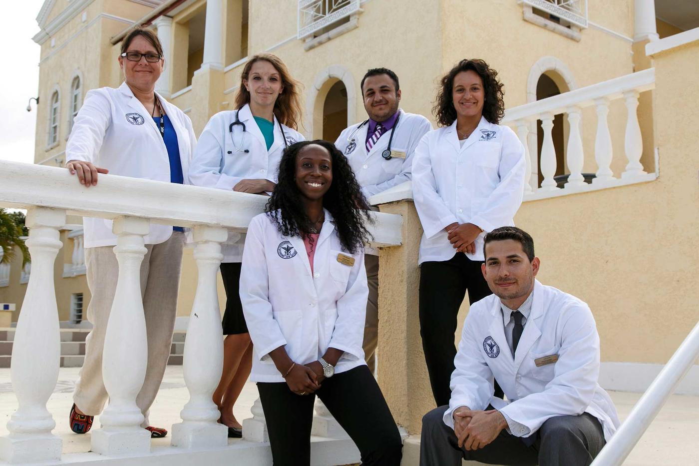 Group picture of AUC students in white coats