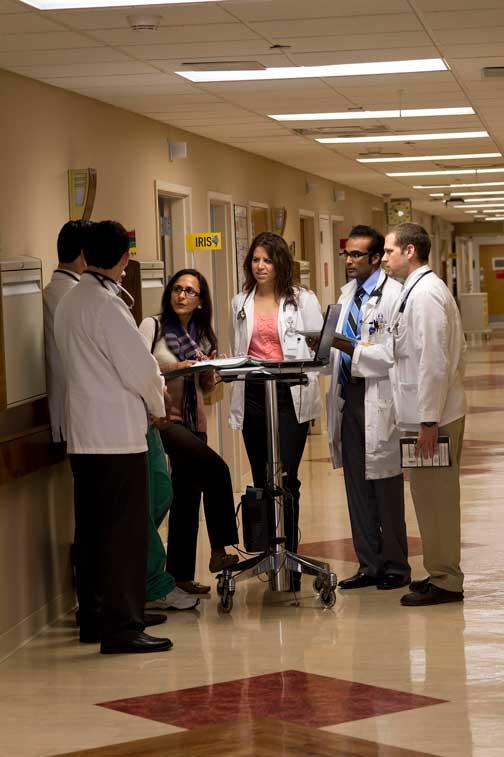 Doctors working together in hallway