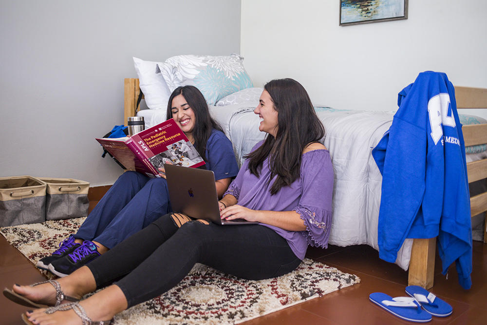 Students studying in dorm room