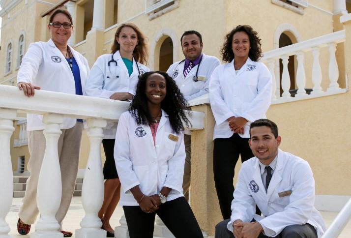 Group picture of people in AUC whitecoats