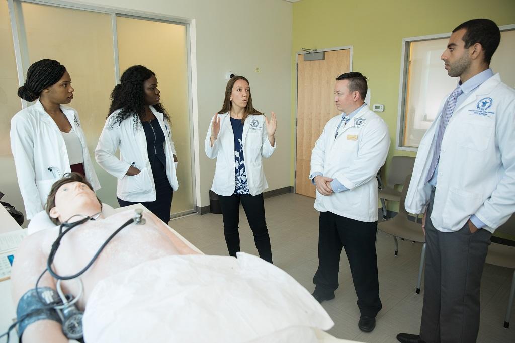 Faculty and students in simulation lab