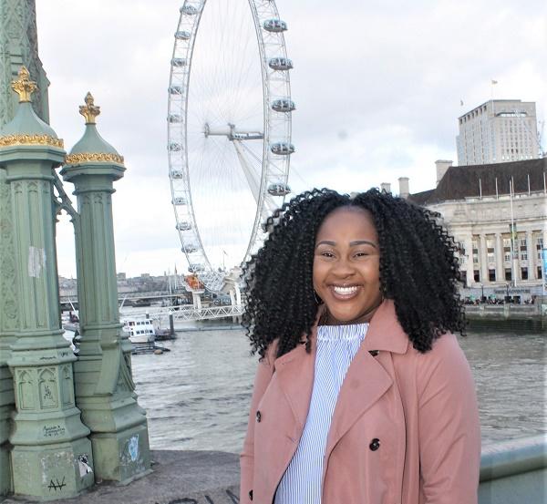 Woman standing in front of the London Eye