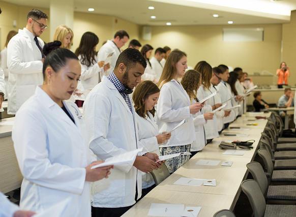 Group of white coat students